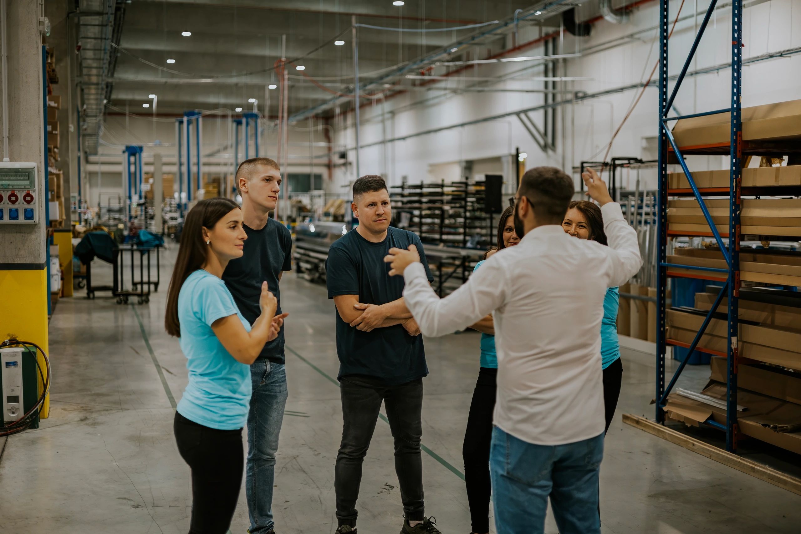 Industrial team discussing operations in a production facility