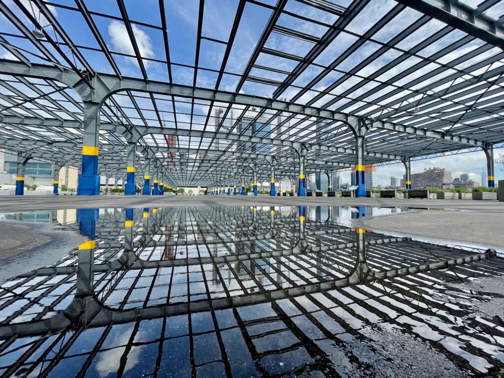 Open steel canopy structure with reflective paving